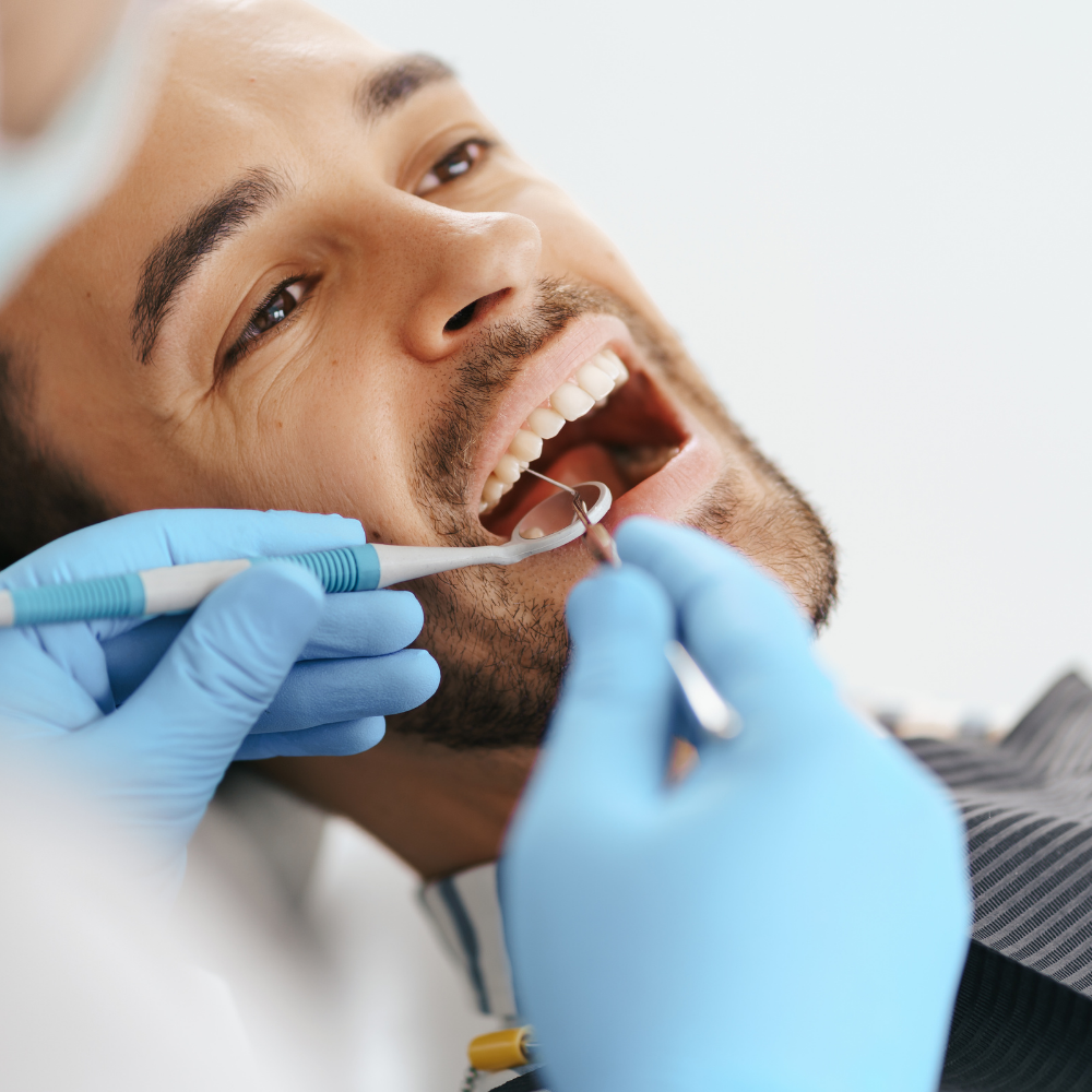 Dentist examining patients smile